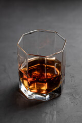 whiskey glass on a concrete background with copy space. alcohol addiction concept