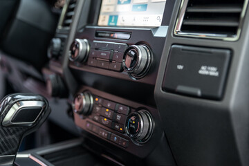 Luxury car Interior - multimedia display, shift lever and dashboard. Interior detail of new modern...