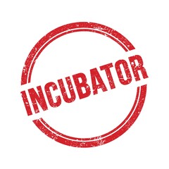 INCUBATOR text written on red grungy round stamp.