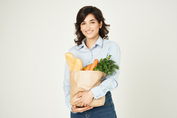 woman with a package of groceries housewife shopping in the supermarket