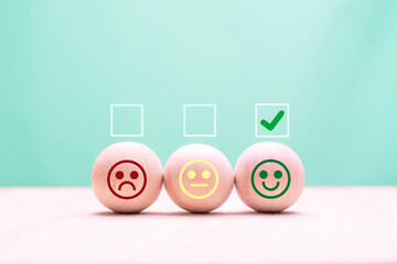check mark on happy smiley face in wooden circle for feedback rating and positive customer review...