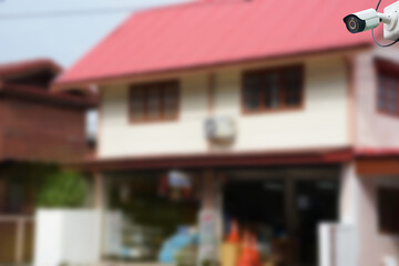 CCTV security camera with background blurred rural shop.