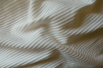 Soft folds on white viscose and polyester ribbed fabric