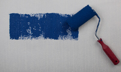 Roller brush painting, Worker painting on surface wall painting apartment, renovating with dark...