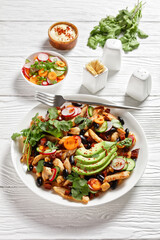 Mexican salad of black beans, chicken, and radish