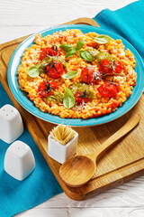 creamy tomato risotto with pesto, top view