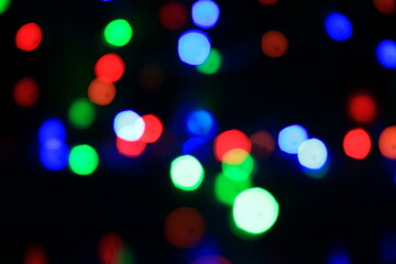 Abstract multi colored lights on a black background.