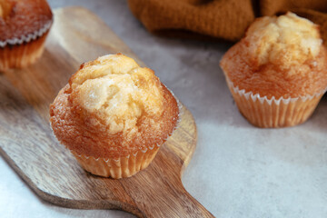 freshly baked mini muffins on a rustic table