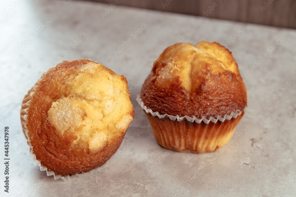 Wall mural freshly baked mini muffins on a rustic table