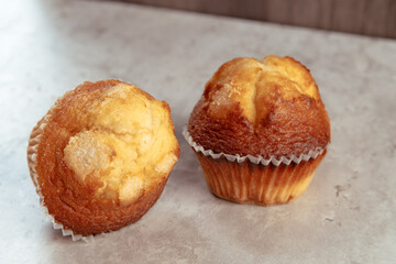 freshly baked mini muffins on a rustic table