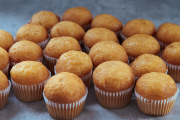 freshly baked mini muffins on a rustic table