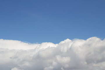 White clouds in the blue sky. Cloud background.