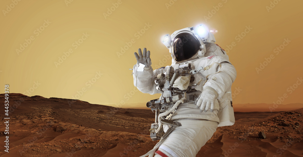 Poster Astronaut in a space suit and a helmet with light stands on the red planet Mars greets and waves his hand. Welcome to Mars concept. Space man travels