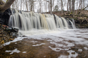 Long exposure waterfall on small river Ivande in Renda, Latvia.