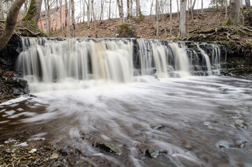 Long exposure waterfall on small river Ivande in Renda, Latvia.