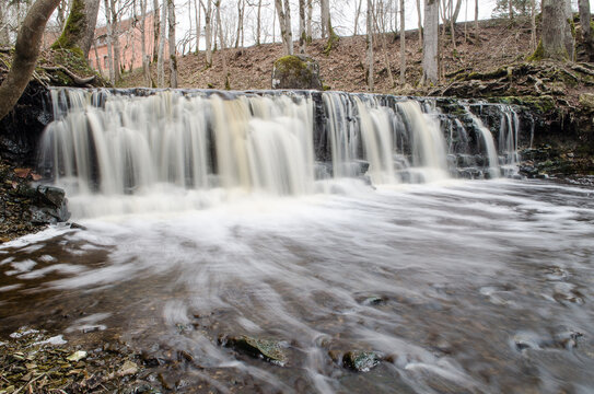 Long exposure waterfall on small river Ivande in Renda, Latvia. © Bargais