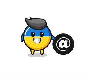 Cartoon Illustration of ukraine flag badge standing beside the At symbol