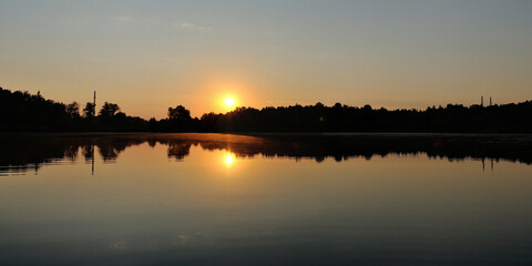 Summer fishing on the lake, dawn.