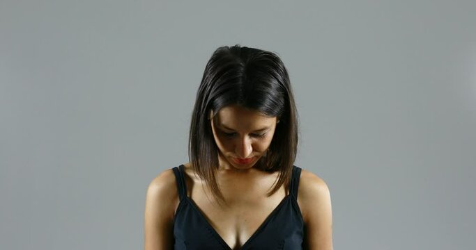 an accusing hand points to a woman's face, humiliating her