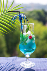 blue drink with mint and cherry ice. Restaurant soft drink