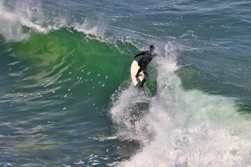 Surfing big summer waves at Point Dume California