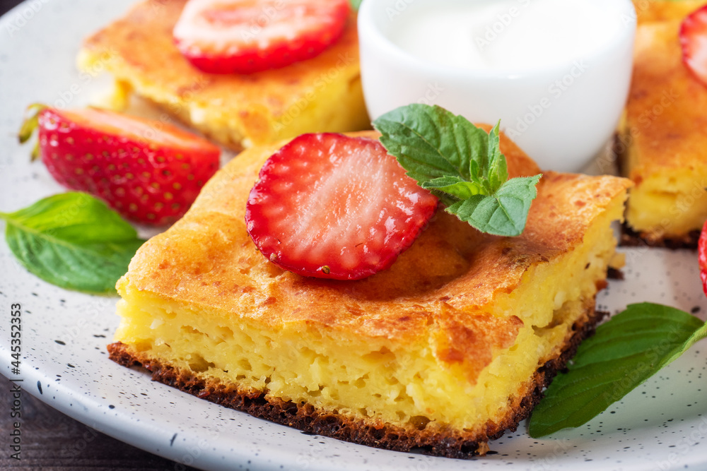 Wall mural cottage cheese casserole with strawberries and mint. delicious homemade dessert made of curd and fre - Wall murals