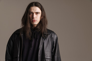 Fototapeta premium Young fashionable white man wearing leather jacket