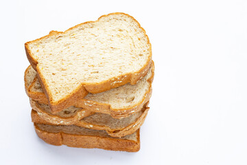 Stack of sliced wholegrain bread on white