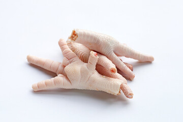 Raw chicken feet on white background