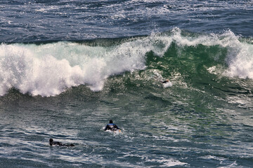 Surfing big summer waves at Point Dume California