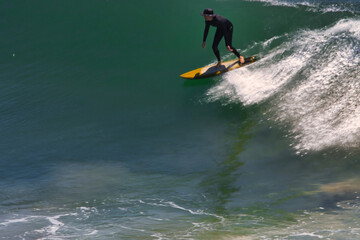 Surfing big summer waves at Point Dume California