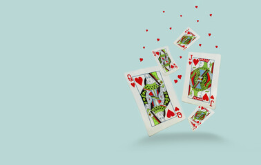 Playing cards with hearts in the air 