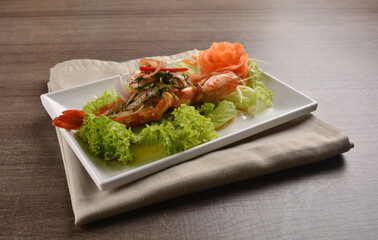 grilled bbq big tiger prawn seafood with Thai spicy chilli sauce on wood background asian halal menu