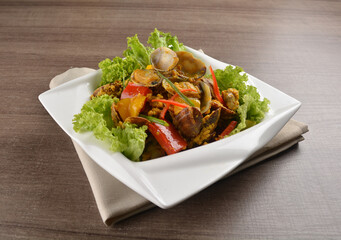 stir fried flower clam shell seafood with sambal spicy chilli sauce on wood background asian halal menu