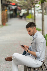 Fototapeta premium Checking his phone