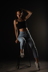 Posing on the high chair while holding great posture