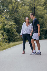 Male and female athletes preparing for a marathon, run, workout. Healthy lifestyle concept.