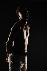 Obraz na płótnie Canvas Silhouette of topless black male