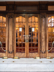 Theatre Doors, London. The ornate wooden doors to the main entrance of a traditional old West End theatre. - 445358381