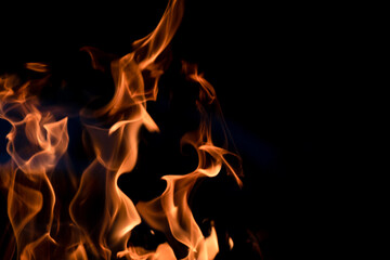 The fire. Flames. Banner, abstract background, wallpaper. Flame on a black background.