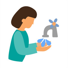 The girl washes her hands under the tap with water