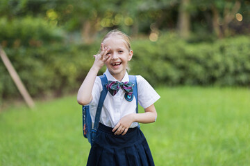 Back to school. Little girl from elementary school outdoor. Kid going learn new things 1th september