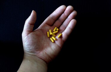 Capsules of tablets, medicine are in your hand. Choice in taking medication