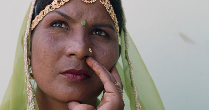 Portrait Of A Young Indian Female Wearing A Green Sari