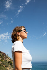 Obraz premium Natural beauty of as young lady in her vacation time enjoying her holidays in a beach of the coast side in a tourist location. breathing with a freedom feeling