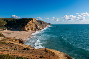 Naklejka premium Scenic view of the Sao Juliao Beach (Praia de Sao Juliao) near the village of Ericeira, in Portugal.