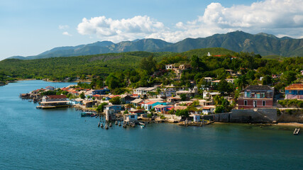 Fototapeta na wymiar Colorful buildings and villas on the coast line of Santiago de Cuba, Cuba