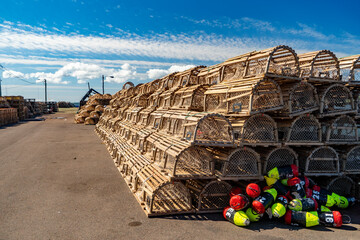 Lobster traps piled on a wharf in rural Prince Edward Island, Canada.