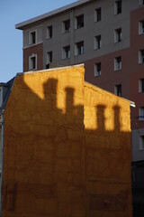 Fototapeta na wymiar Shadow of chimneys on a facade