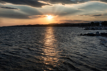 Beautiful Sunset over calm sea on beach landscape. Sunset - Sunrise seascape with gentle waves in calm water